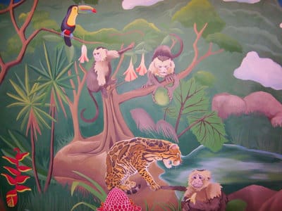 Rainforest mural with jungle animals and volcanos in San Jose, Costa Rica.