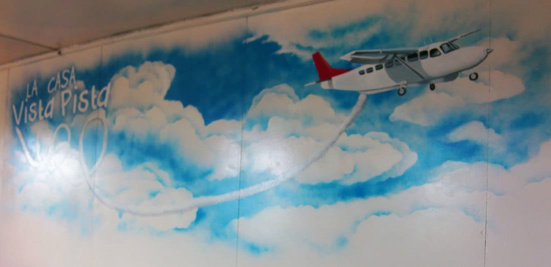 Spraypaint mural of light aircraft in Bocas del Toro