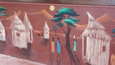 African village mural mountain background from Zanzibar cafe.