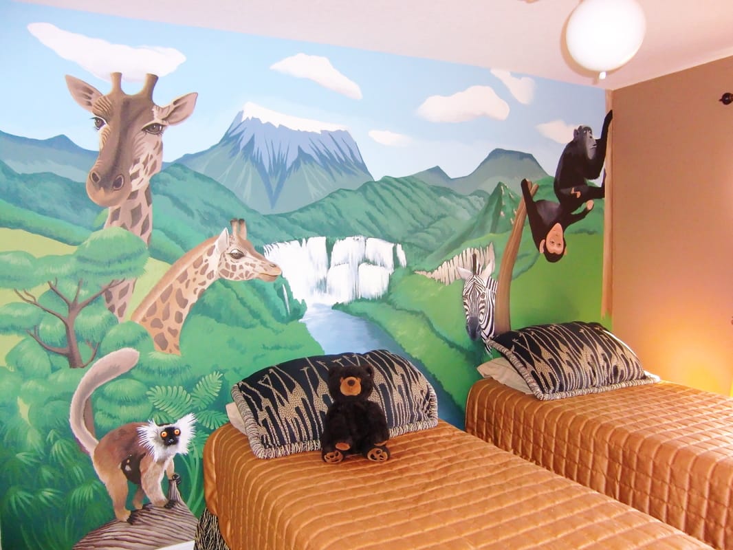 African themed Childrens mural with jungle animals, forest and mountains.