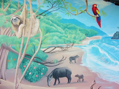 Costa Rican rainforest mural with jungle animals and tropical beach scene. 