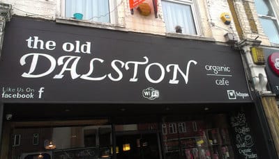 Hand painted sign and shopfront in Dalston, England.