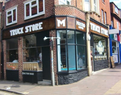 Shopfront and signs with 3d lettering in Cowley Road,  Oxford.